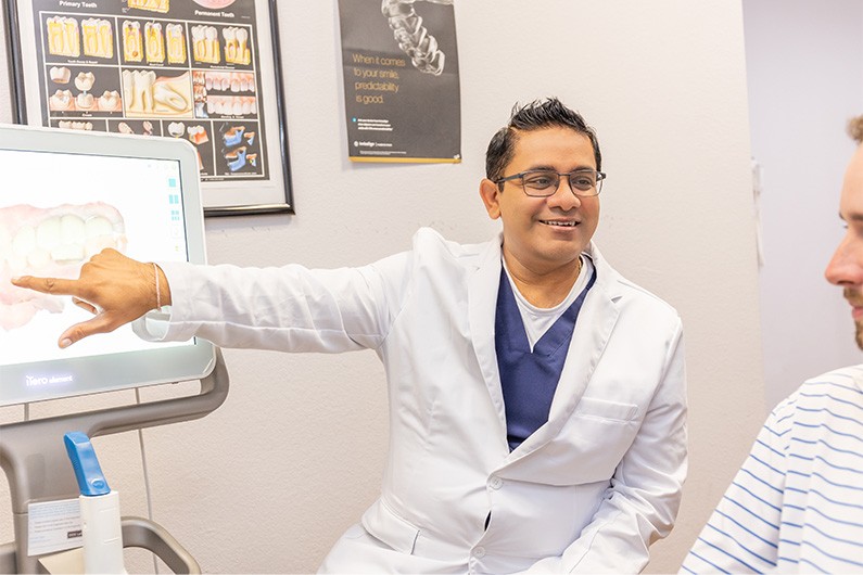 Fort Worth Texas dentist showing a patient x rays of their teeth