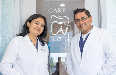 Two dentists by front door of Care 32 Dental of Fort Worth