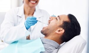 Patient being worked on by dentist. 