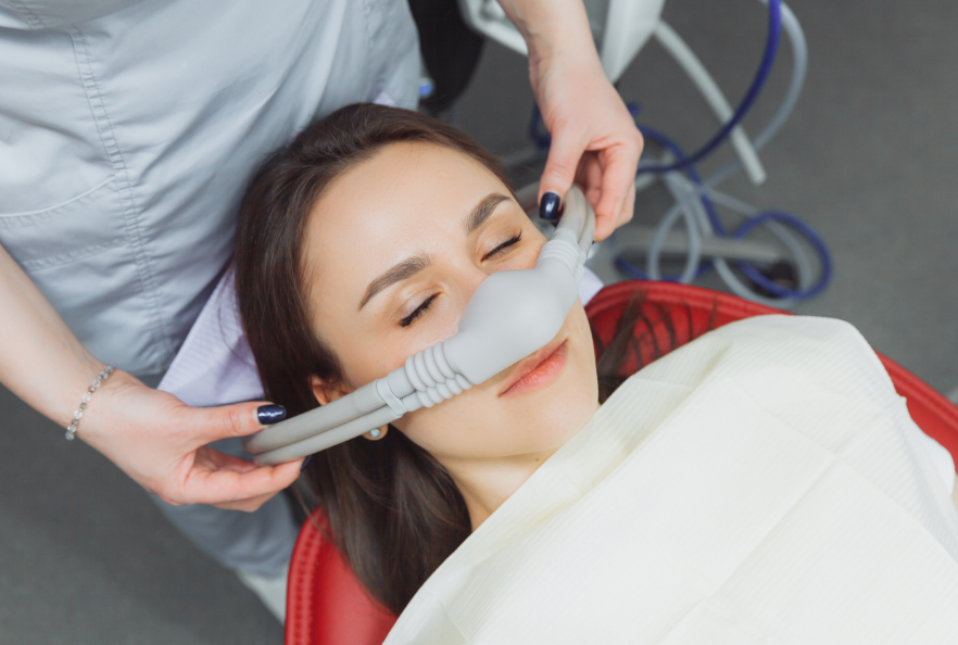 Woman undergoing dental sedation